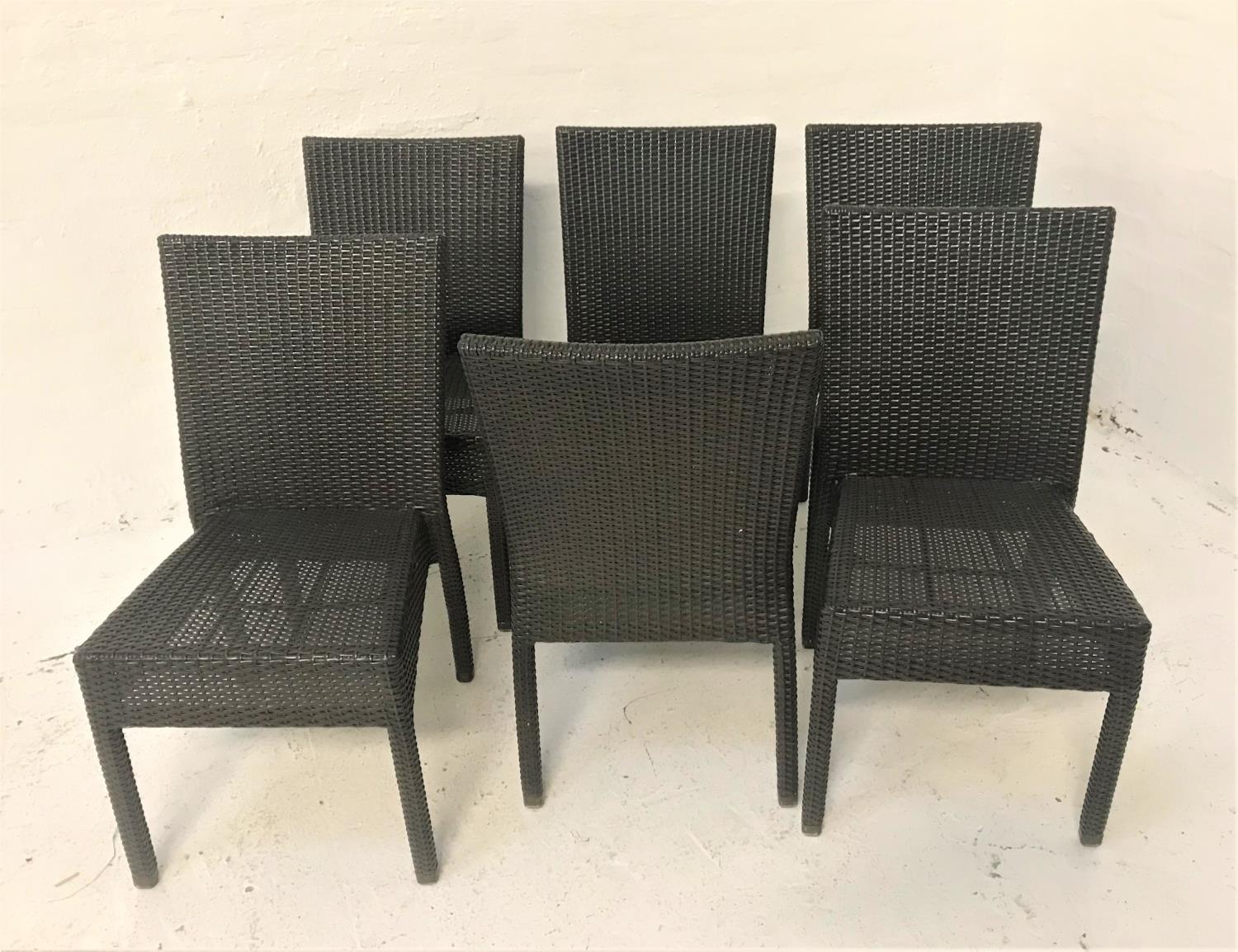 SET OF SIX ALL WEATHER RATTAN EFFECT CHAIRS with woven backs and seats, standing on plain