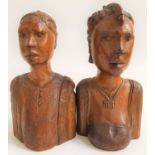 TWO AFRICAN CARVED WOODEN BUSTS depicting a man and woman, 21cm high (2)