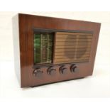 FERRANTI 105 RADIO in a stained case with a glass tuning dial and speaker above four bakelite knobs,