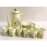 TUSCAN COFFEE SET decorated in the Plant pattern, comprising six coffee cans and seven saucers,