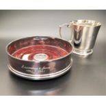 GEORGE V SILVER CHRISTENING CUP the circular cup with motif decorated foot and scroll handle,