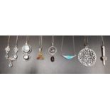 GOOD SELECTION SEVEN SILVER PENDANT ON SILVER CHAINS including an aquamarine set necklace with