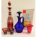 BOHEMIAN RUBY GLASS DECANTER with stopper and vine decoration to the collar, 36.5cm high, two