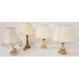 PAIR OF TABLE LAMPS raised on cream painted circular bases with turned columns with gilt highlights,