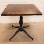 OAK SQUARE TOPPED BAR TABLE standing on pedestal column with four outswept supports, 70cm wide and