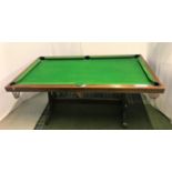 COMBINATION SNOOKER/DINING TABLE with a removeable two section oak top revealing a green baize lined