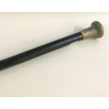 GEORGE V SILVER TOP WALKING CANE the handle with chased decoration on a tapering ebonised cane