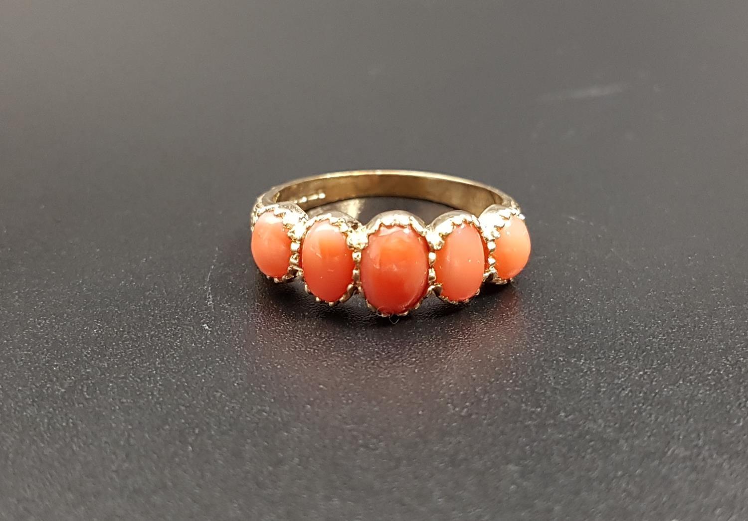 GRADUATED CORAL FIVE STONE RING the five oval cabochon coral sections on nine carat gold shank, ring