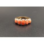 GRADUATED CORAL FIVE STONE RING the five oval cabochon coral sections on nine carat gold shank, ring
