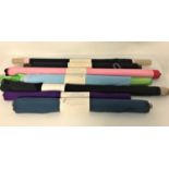 SEVEN ROLLS OF VARIOUS FABRIC including purple, pink, and black satin, teal coloured taffeta,