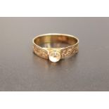 STONE SET UNMARKED GOLD RING the shank with engraved decoration, ring size S and approximately 1.6