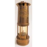 WELSH BRASS MINERS LAMP with suspension hook, bearing a plaque marked 'E. Thomas & Williams Ltd',