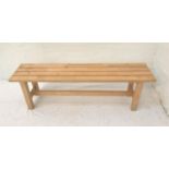 PINE AND BEECH SLATTED BENCH raised on plain supports united by a stretcher, 150cm long