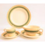 CROWN DUCAL DINNER SERVICE with a cream ground, green border with gilt highlights, comprising soup