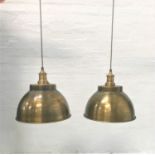 PAIR OF ANTIQUE BRASS EFFECT INDUSTRIAL PENDANT LIGHTS with domed shades and interior textured