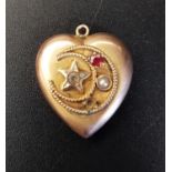 RED GEM AND SEED PEARL HEART SHAPED PENDANT in unmarked gold, decorated with star and crescent