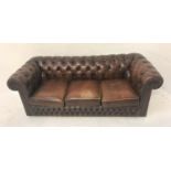 BROWN LEATHER CHESTERFIELD SOFA with a button back, arms and lower front section, with loose seat