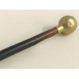 SWAGGER STICK from The Cameronians (Scottish Rifles), the ebonised cane with a brass cap, 68.5cm