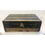 VINTAGE TRAVEL TRUNK with a wooden banded lift up lid and reinforced metal corners, with side