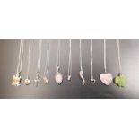 EIGHT SILVER PENDANTS ON SILVER CHAINS including a Navajo turtle pendant by D. SLoane, a rose quartz