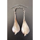 ATTRACTIVE PAIR OF SILVER DROP EARRINGS in the form of teardrop shaped flowers with long central