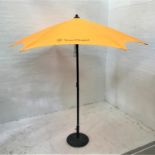 VEUVE CLICQUOT BRANDED ORANGE GARDEN PARASOL with weighted circular stand, 260cm diameter