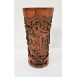 CHINESE BAMBOO BRUSH POT decorated with carved scholars in a garden scene, 27.5cm high