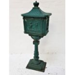 METAL POST BOX raised on an oblong base with a decorative column and oblong box with a door and post