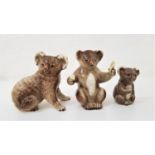 THREE BESWICK KOALAS one holding a eucalyptus leaf and numbered 1089 and a small example numbered