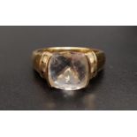 QUARTZ DRESS RING the central cushion ckeckerboard faceted gemstone flanked by three round cut