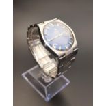 TISSOT PR 516 WRISTWATCH the blue dial with baton markers and date aperture at 3, with an