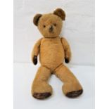 EARLY 20th CENTURY GOLD PLUSH TEDDY BEAR with jointed limbs and bead eyes, 60cm high