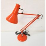 RETRO ANGLEPOISE LAMP raised on a circular weighted base, in bright orange