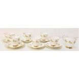 ELIZABETHAN TEA SERVICE with a white ground and yellow rose decoration with gilt highlights,