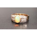 OPAL AND DIAMOND DRESS RING the central oval cabochon opal flanked by three rows of diamond to