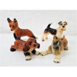 FOUR GERMAN DOG FIGURINES makes include Goebel and Cortendorf, the largest 11.3cm high (4)