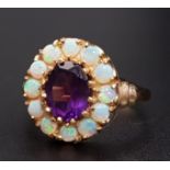 AMETHYST AND OPAL CLUSTER RING the central oval cut amethyst approximately 1.1cts in 12 opal