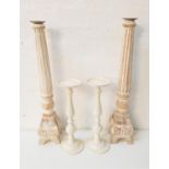 PAIR OF CORINTHIAN STYLE WOODEN CANDLESTICKS of tapering form, 65cm high, together with a pair of