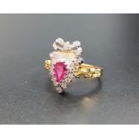 UNUSUAL RUBY AND DIAMOND CLUSTER RING the pear cut ruby in diamond surround and surmounted by a