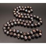 LONG BLACK FRESHWATER BAROQUE PEARL NECKLACE with individually knotted pearls, approximately 92cm