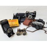 SELECTION OF CAMERA AND OPTICAL EQUIPMENT comprising Zorki-4k camera in case, Kodak junior II