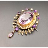 EDWARDIAN AMETHYST AND SEED PEARL PENDANT the central large oval cut amethyst in seed pearl surround