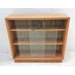 LIGHT TEAK BOOKCASE with a rectangular top now applied with a light oak transfer, above a pair of