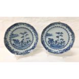 PAIR OF 18TH CENTURY CHINESE CHARGERS decorated in blue and white with a floral shaped border around