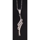 PRETTY DIAMOND SET PENDANT with two rows of channel set diamonds totaling approximately 0.18cts in