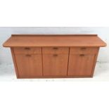 TEAK SIDEBOARD with a raised back and shaped top above three frieze drawers and three cupboard doors