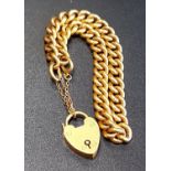 NINE CARAT GOLD CURB LINK BRACELET with nine carat gold heart padlock clasp and safety chain,