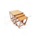 NEST OF G PLAN TEAK TABLES standing on shaped supports, 51.5cm high (3)