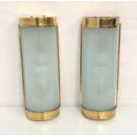 TWO DOMED WALL LIGHTS with brass frames and opaque ribbed glass shades, 50cm long (2)