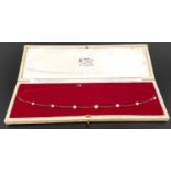 PEARL SET NINE CARAT GOLD NECK CHAIN the chain set with seven graduated pearls, total weight